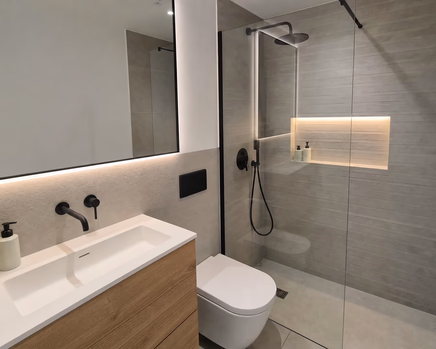 Floating wood vanity in renovated bathroom