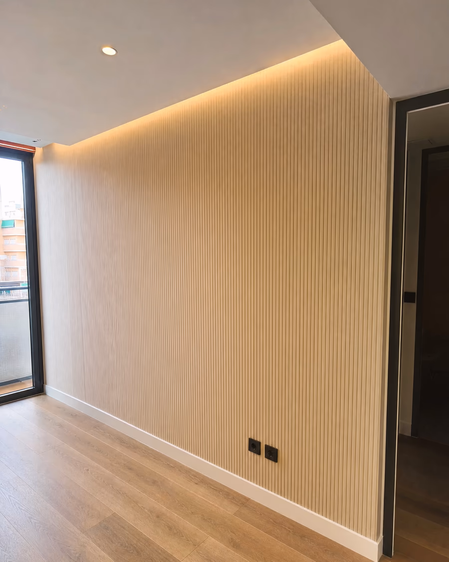 Renovated bedroom with fitted wood wardrobe